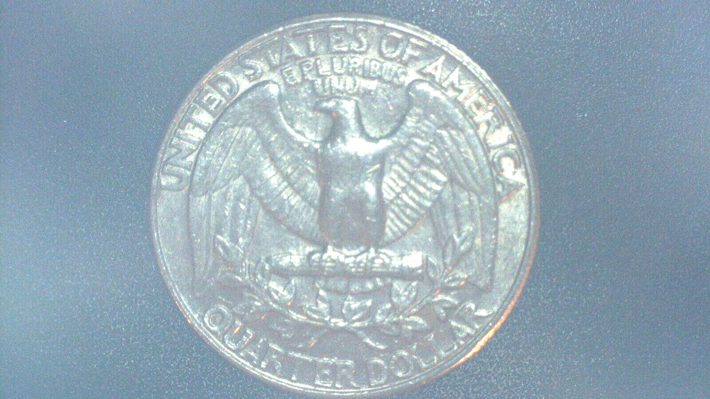 1991 Washington Quarter with a (strike through)