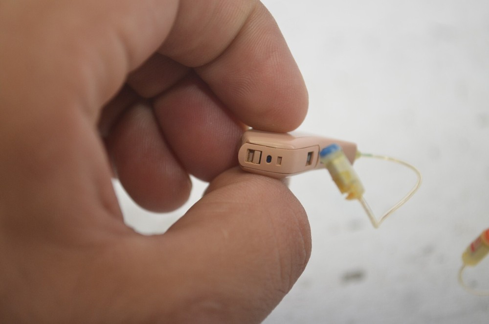 Resound Hearing Aids as is not tested missing button , might affect function