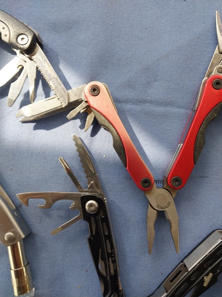 4 small multitudes with pliers knife scissors screwdriver's