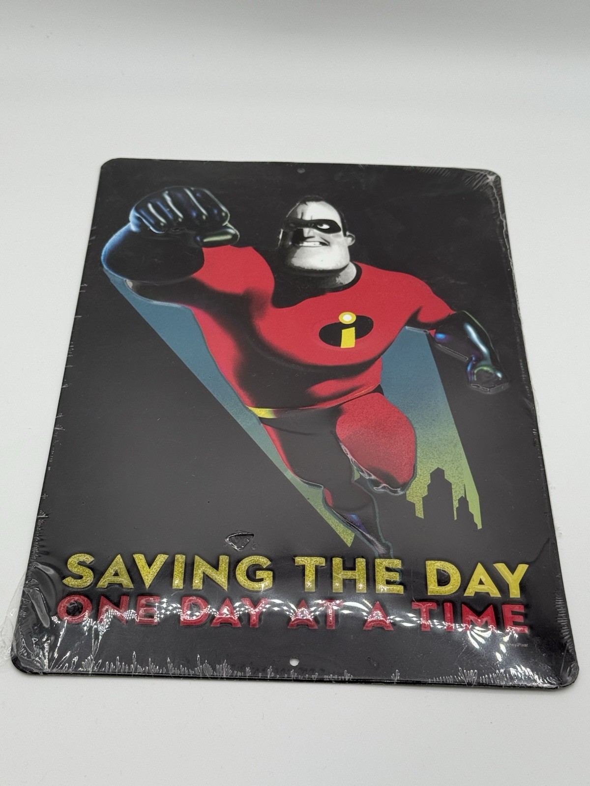 Disney Pixar The Incredibles Mr. Incredible Saving the Day Metal Tin Sign 13x9"