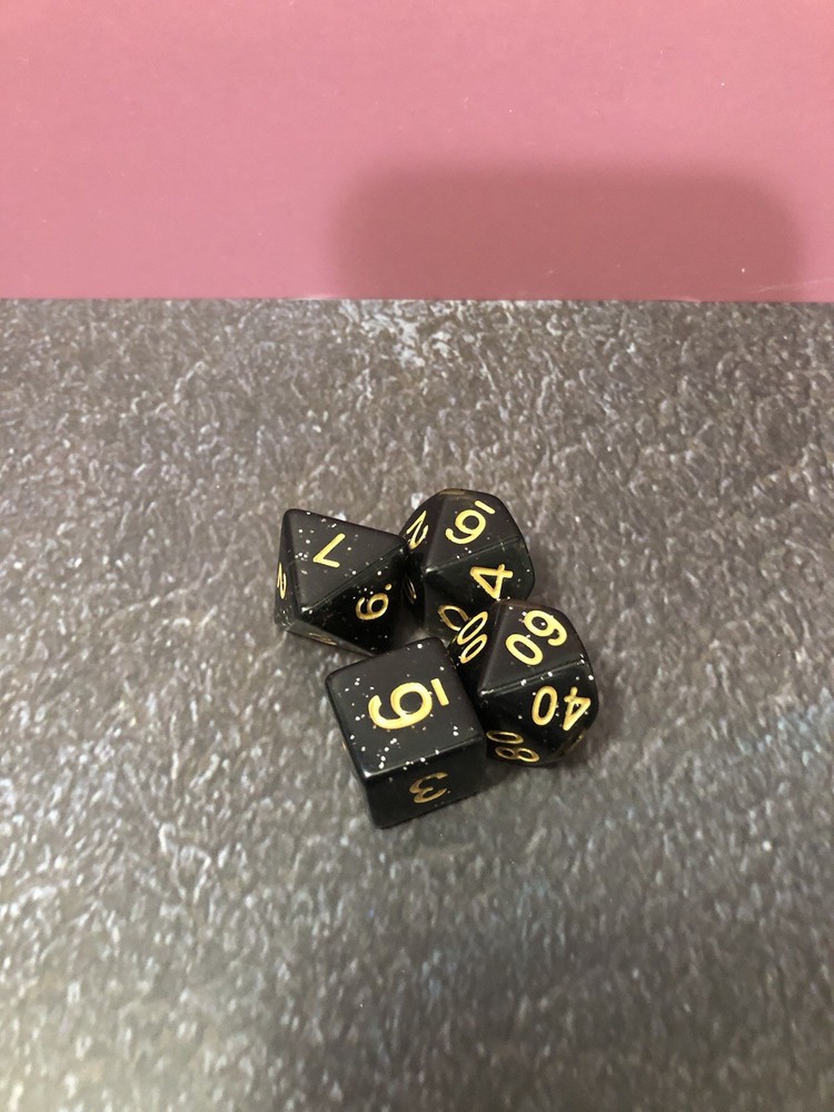 Two 4 Piece Multi Color Dice Sets