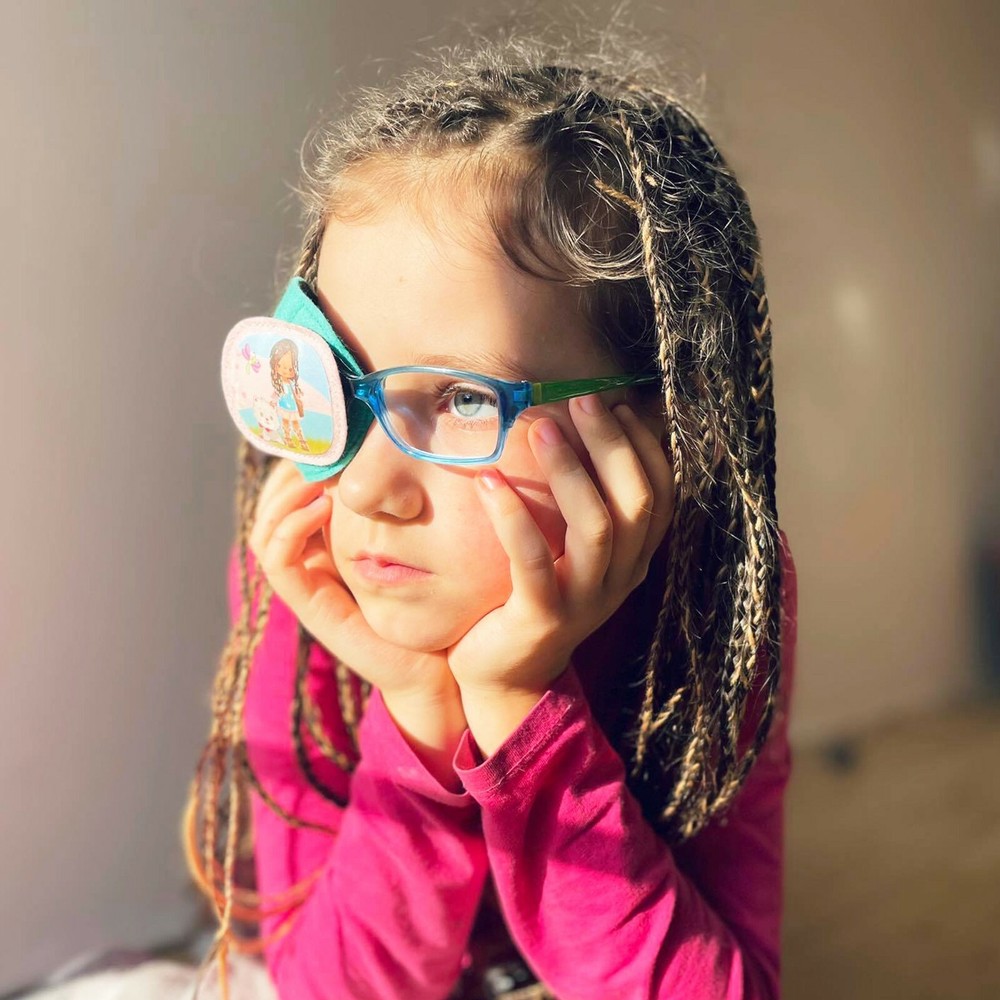 Playful comfortable kids fully obscured eye patch