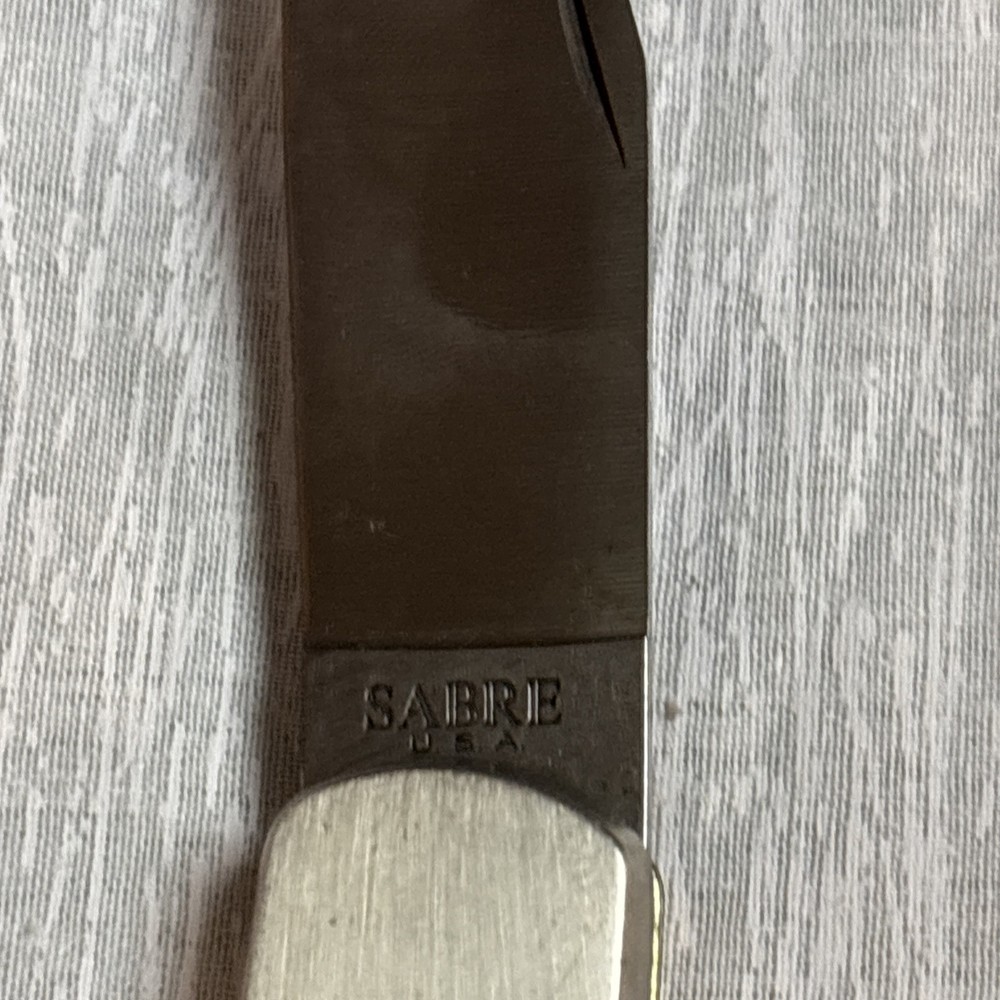 SHARP SABRE U.S.A Kinfe With Leather Covering.
