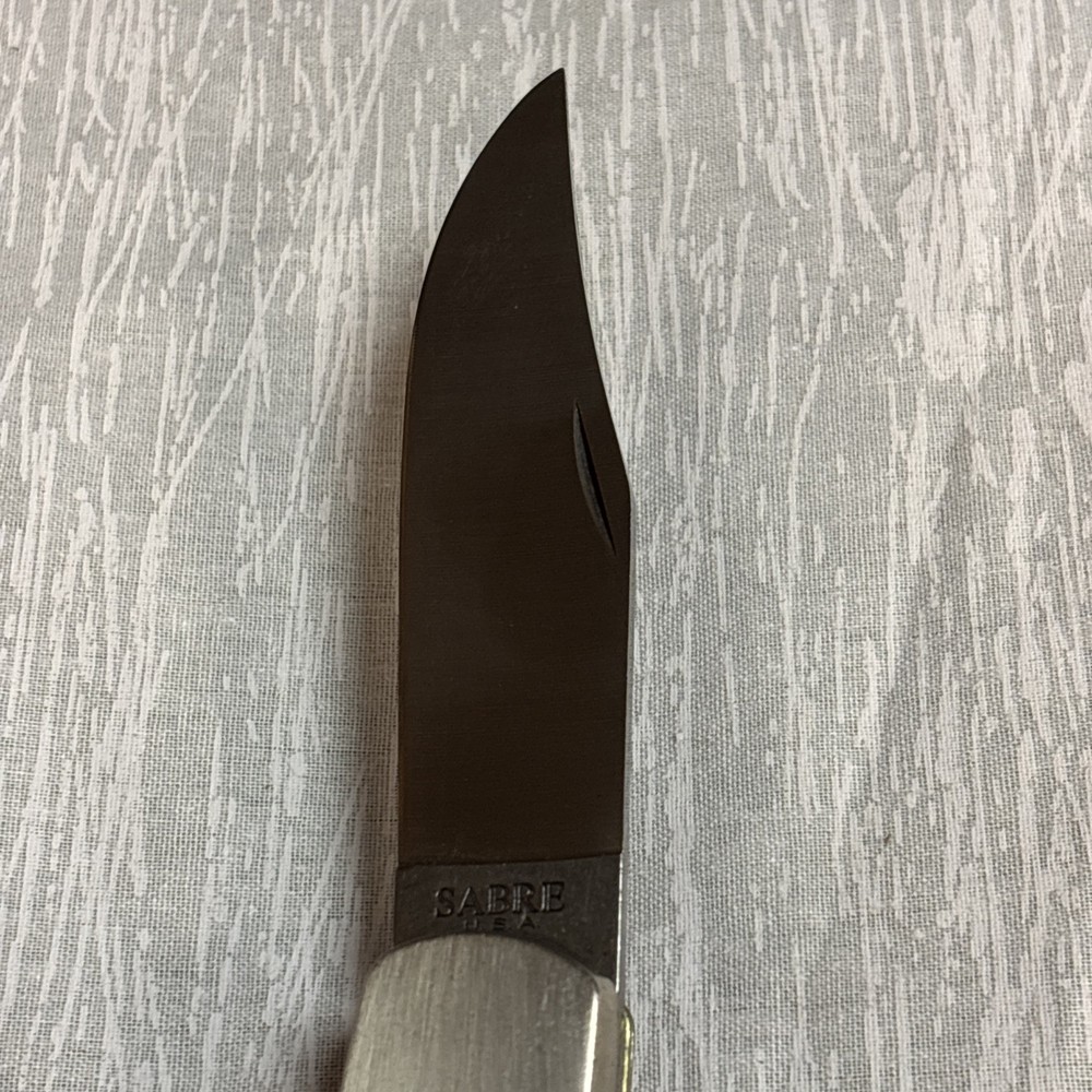 SHARP SABRE U.S.A Kinfe With Leather Covering.