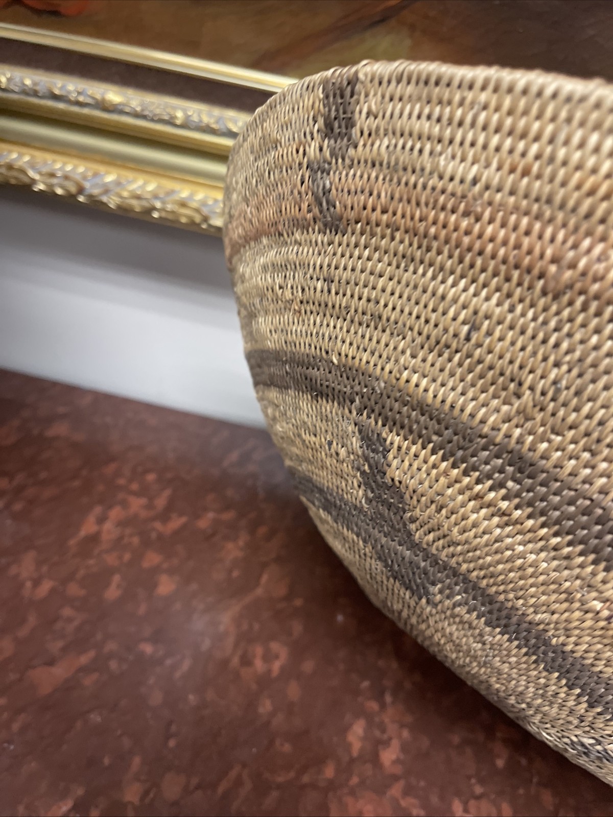 Woven Apache pictorial 17 1/4” basket with geometric and symbolic designs.