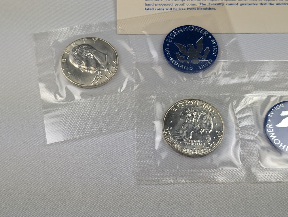 Two (2) 1974 Eisenhower 'Ike' Silver Dollars, Uncirc. Blue Envelope, 2 Coins