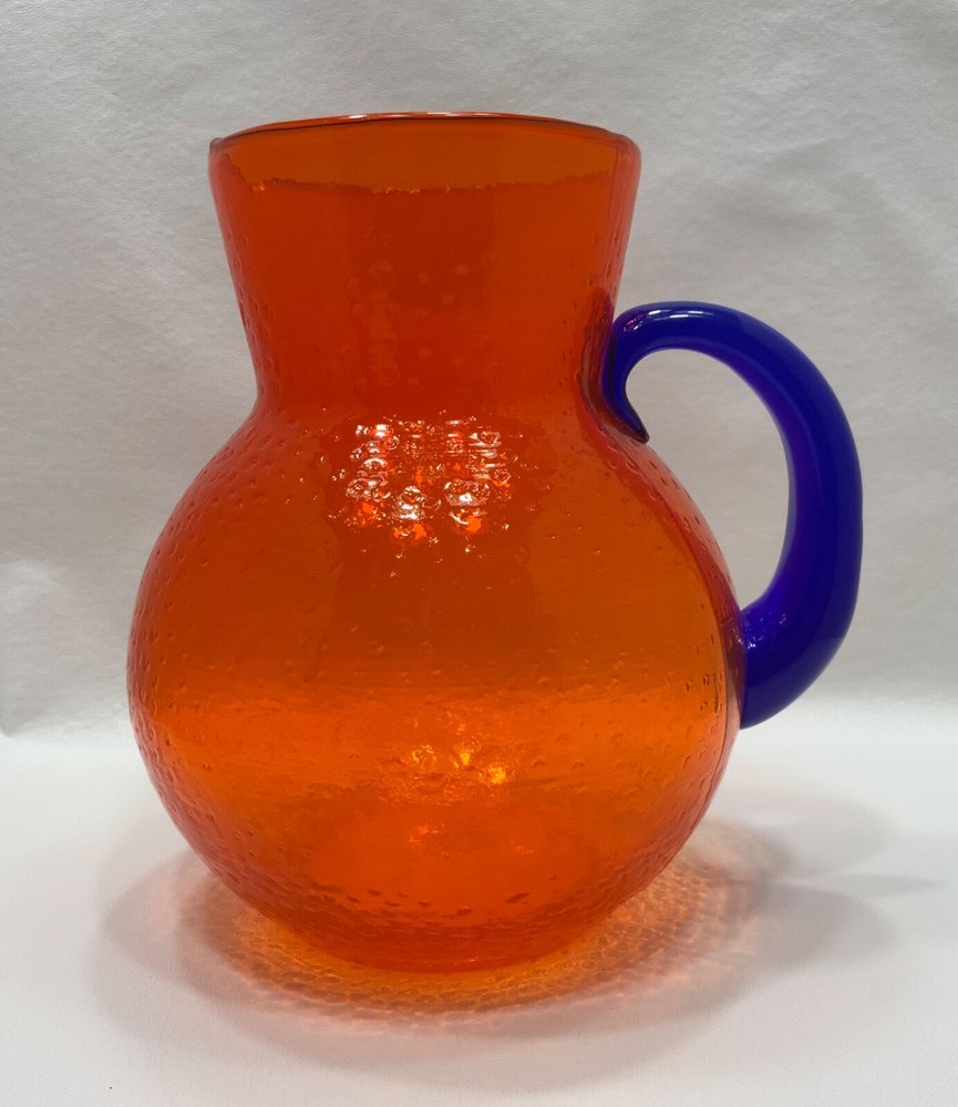 HAND BLOWN ORANGE TEXTURED BUBBLE GLASS PITCHER W APPLIED COBALT BLUE HANDLE