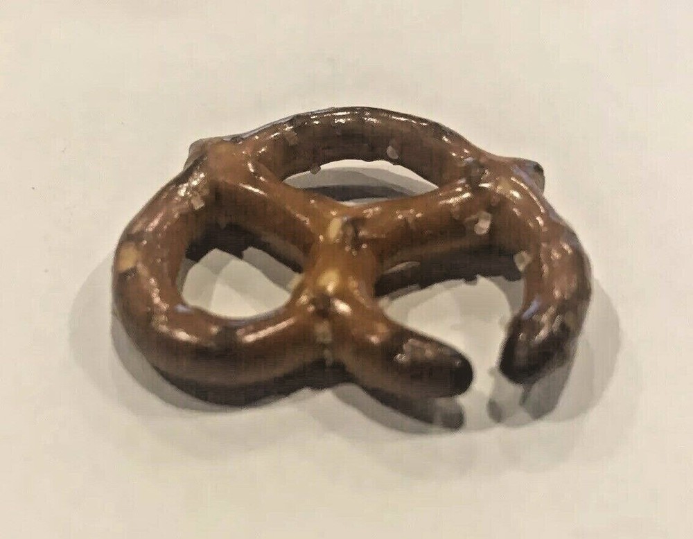 ERROR PRETZEL OPENING WAS LIKELY BURNED WHEN ORIGINALLY MADE