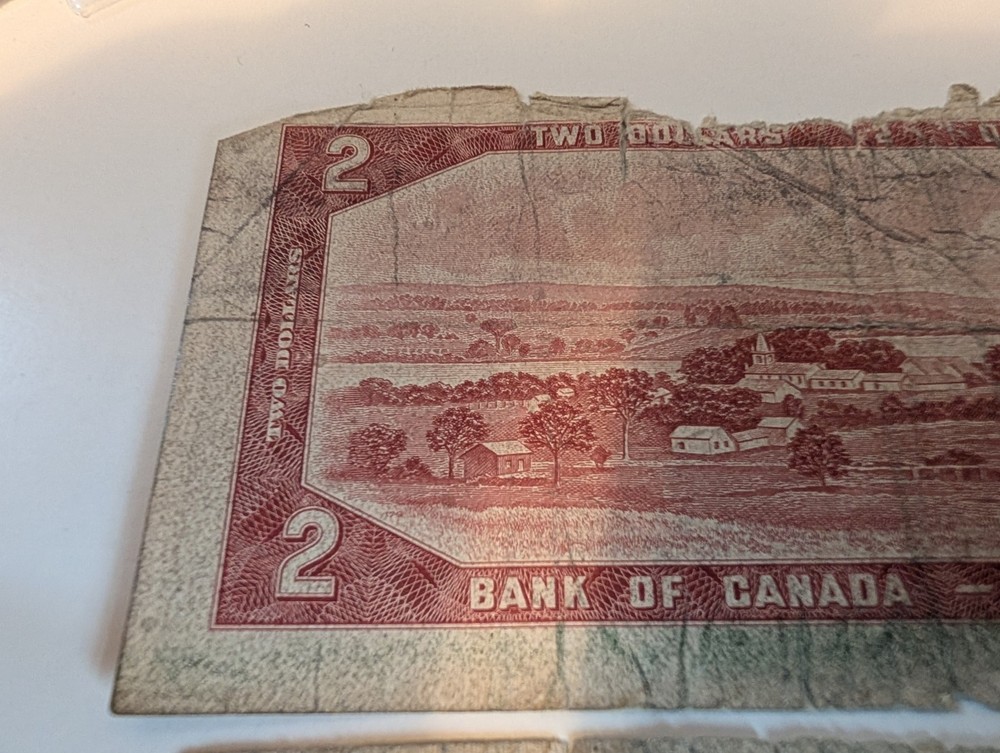 $2 Canadian Note. $1 Bahamas Note