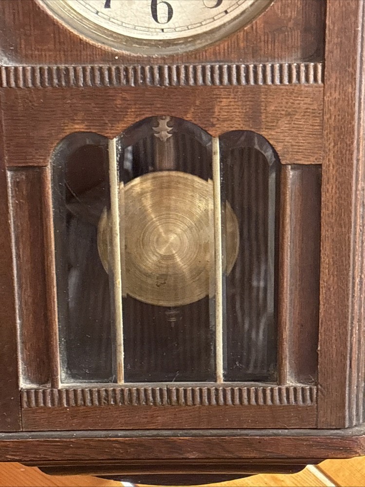 Vintage spring pendulum clock made by Meiji Clock Co.