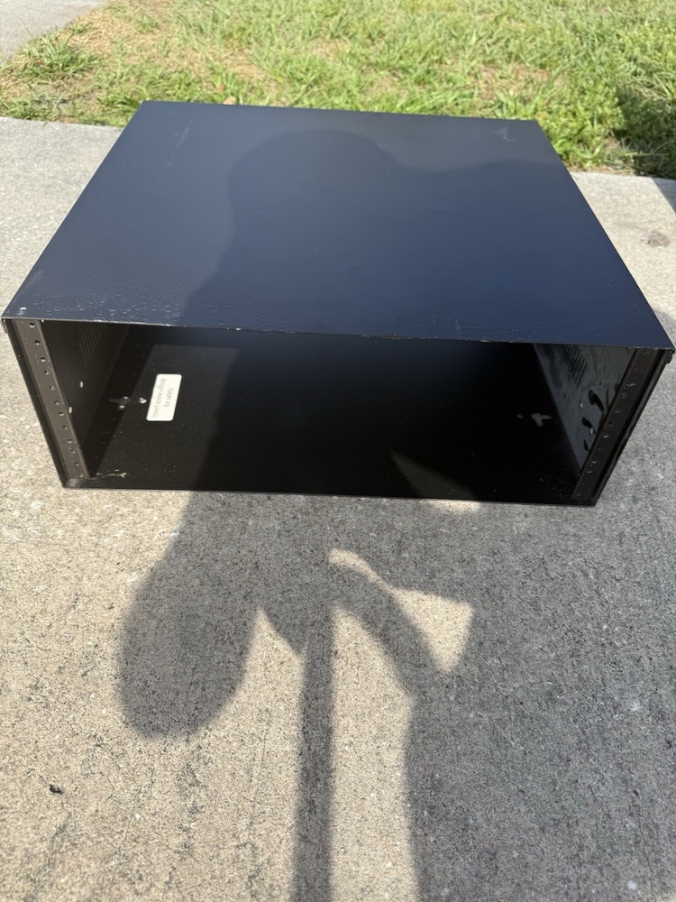 4RU vertical wall mount rack for network equipment and patch panels.