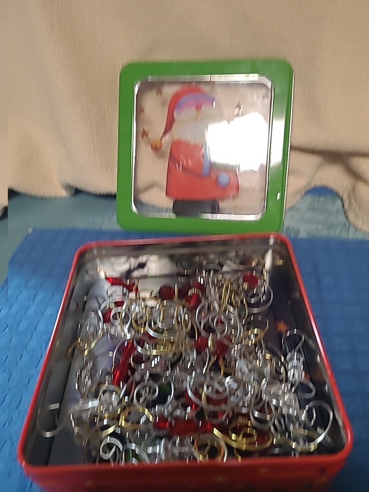 TIN WITH MANY CHRISTMAS HOOKS (BIN M)