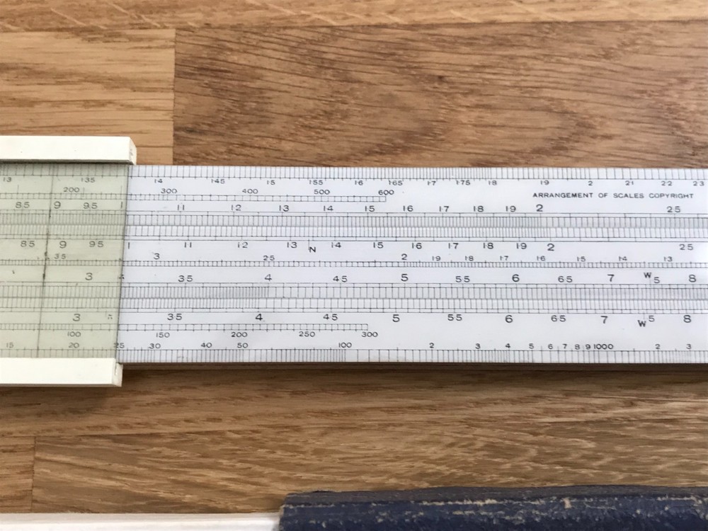 nice old good looking unique electrical slide rule in case