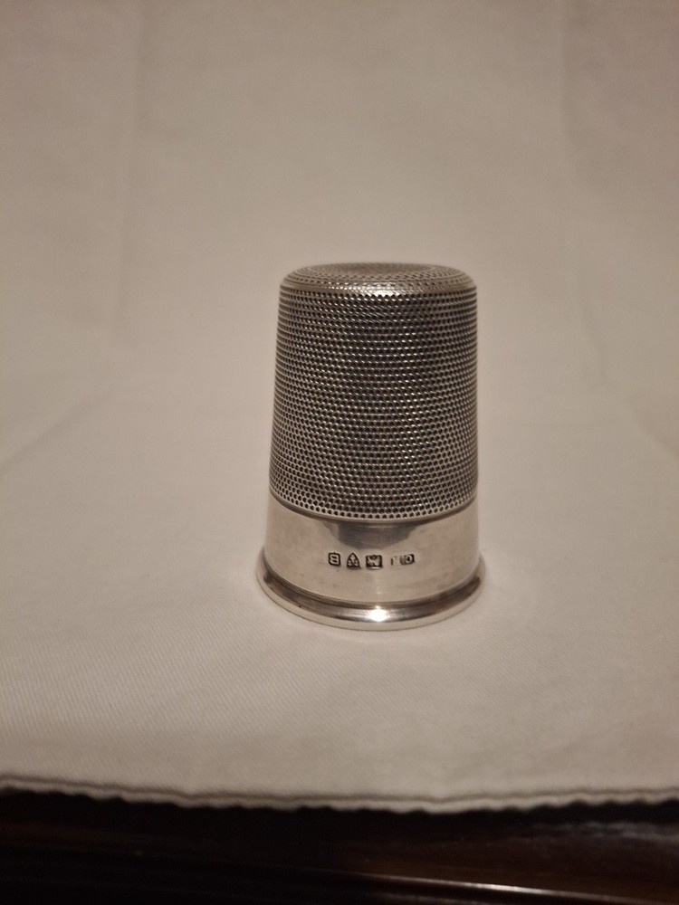 Sterling silver, shot jigger shape like oversized thimble.