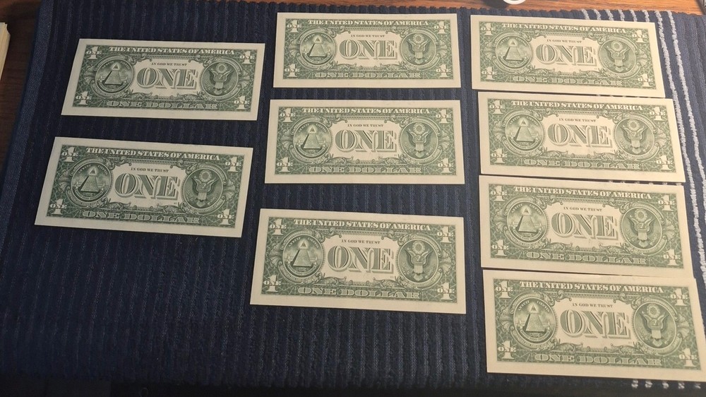 Mint Sequential Serial Numbers with Ink Bleed. Nine 2021 $1 Notes. No creases.