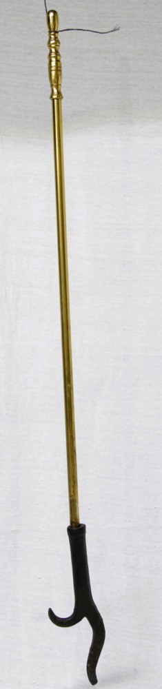 Four-piece brass fireplace poker set