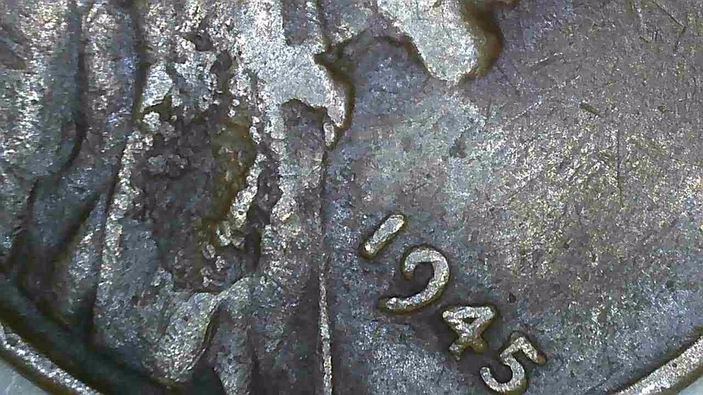 1945 P lincoln penny with lamination error.
