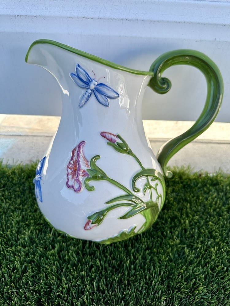 Beautiful ceramic jug and blur. Bas-relief .Temp-tations Dragonfly