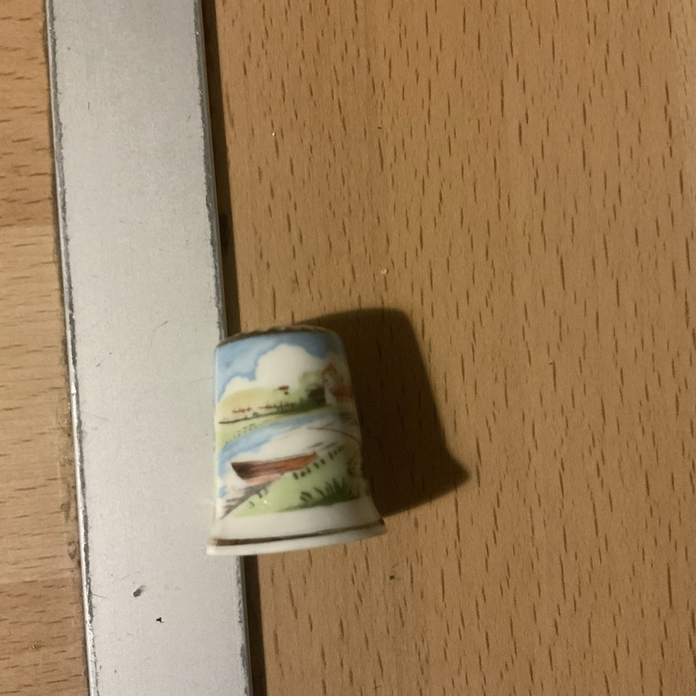 8 thimbles plus a wooden stand