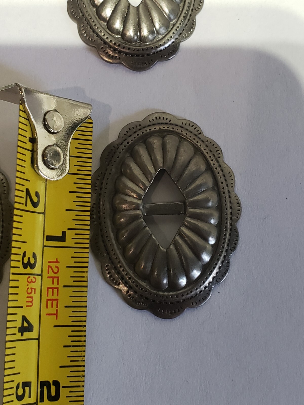 OVAL GUNMETAL GREY/W. STYLE CONCHOS NICE EMBOSSED LOOK 6/PACK 1.5" X 1"