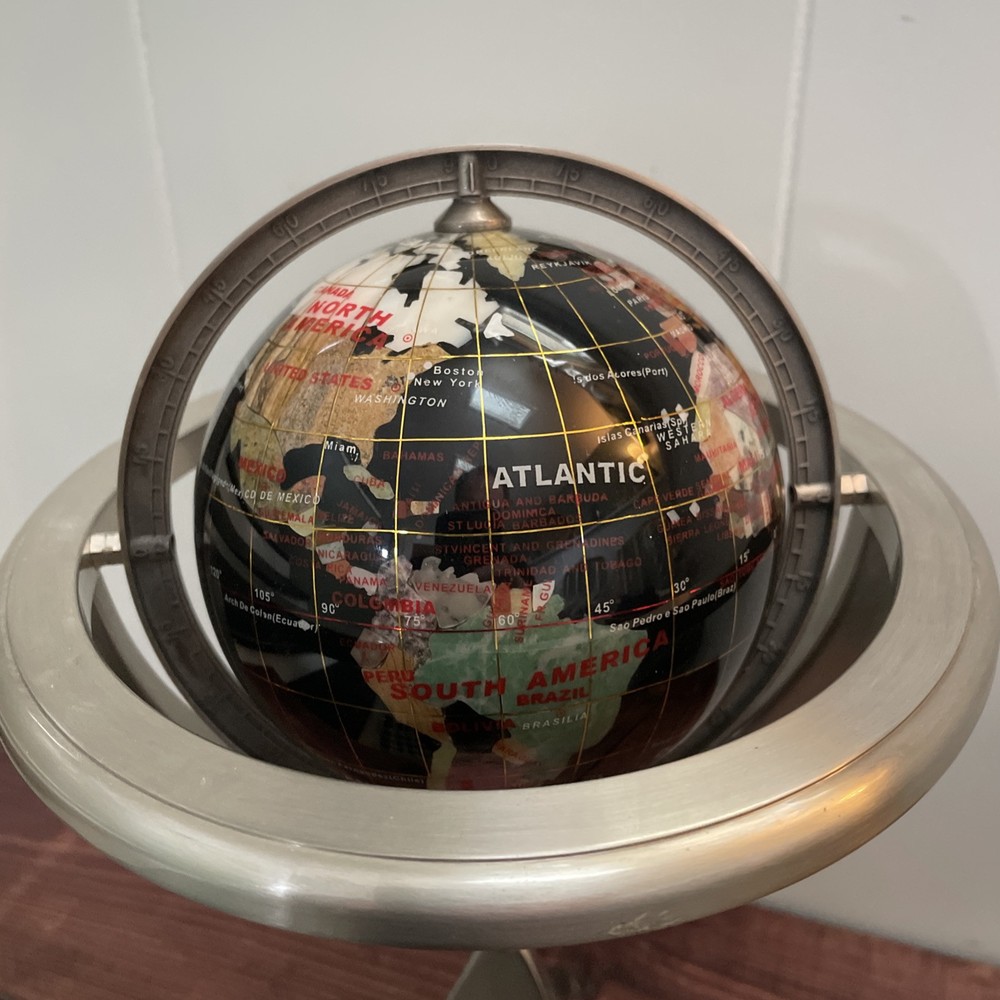 Rotating World Globe On Pyramid