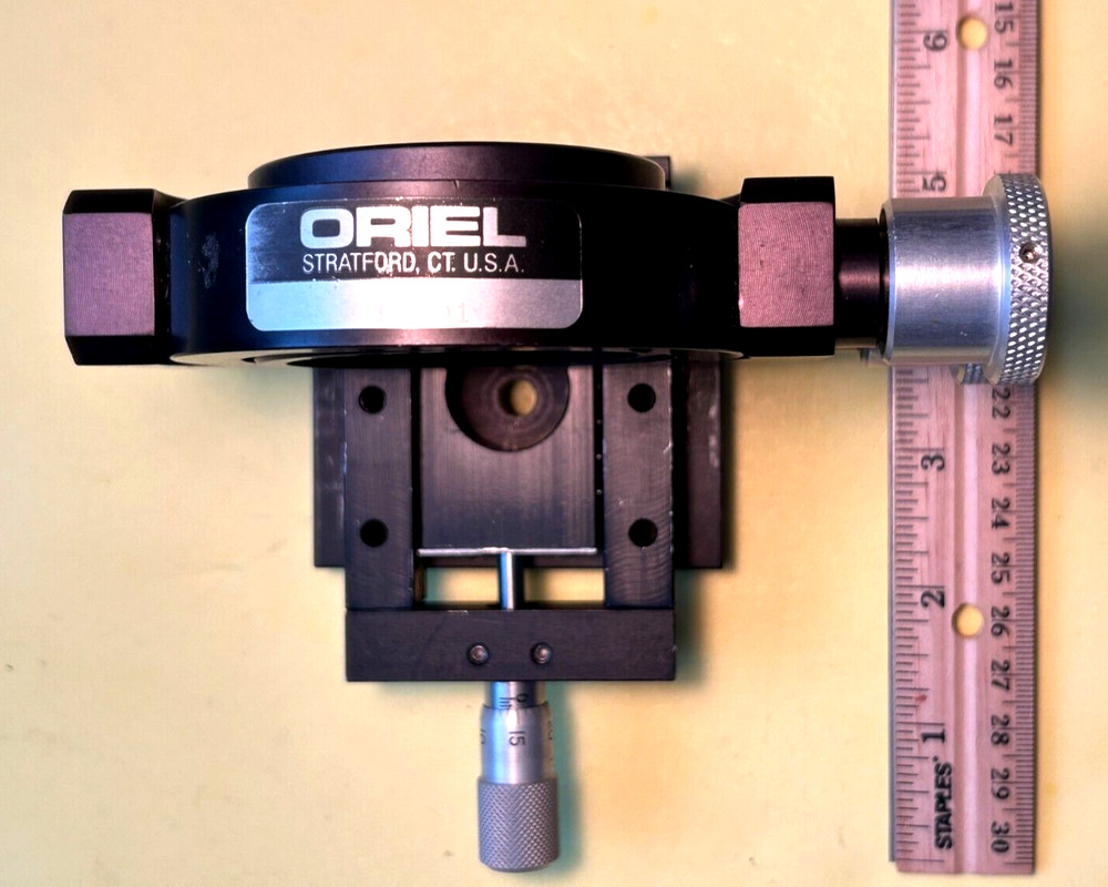 Oriel model 17701 Gimbal mirror mount on linear slide with micrometer.