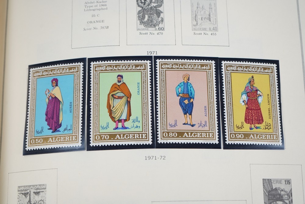 WORLDWIDE A-L 1970s COLLECTION OF 875+ STAMPS MINT & USED STORED IN SCOTT ALBUM