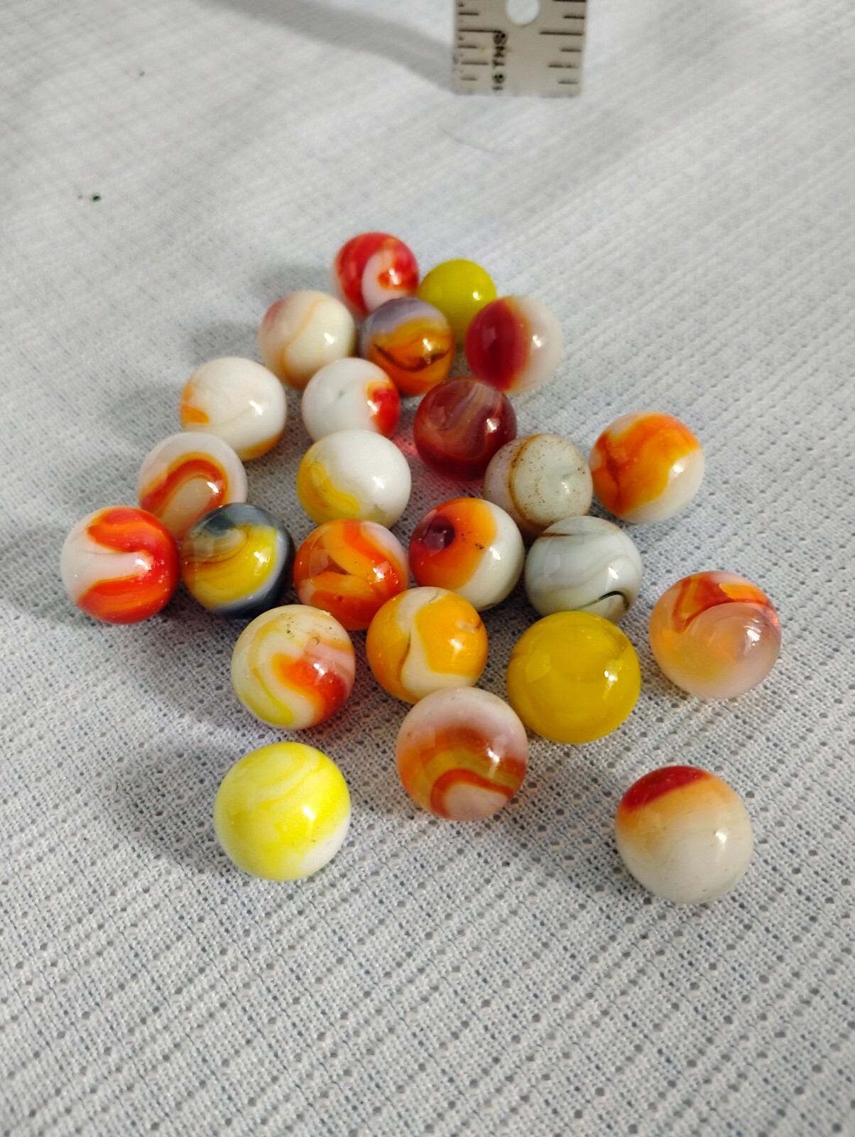 Lot of 24 Cadium filled Glass marbles. Glows red under blacklight