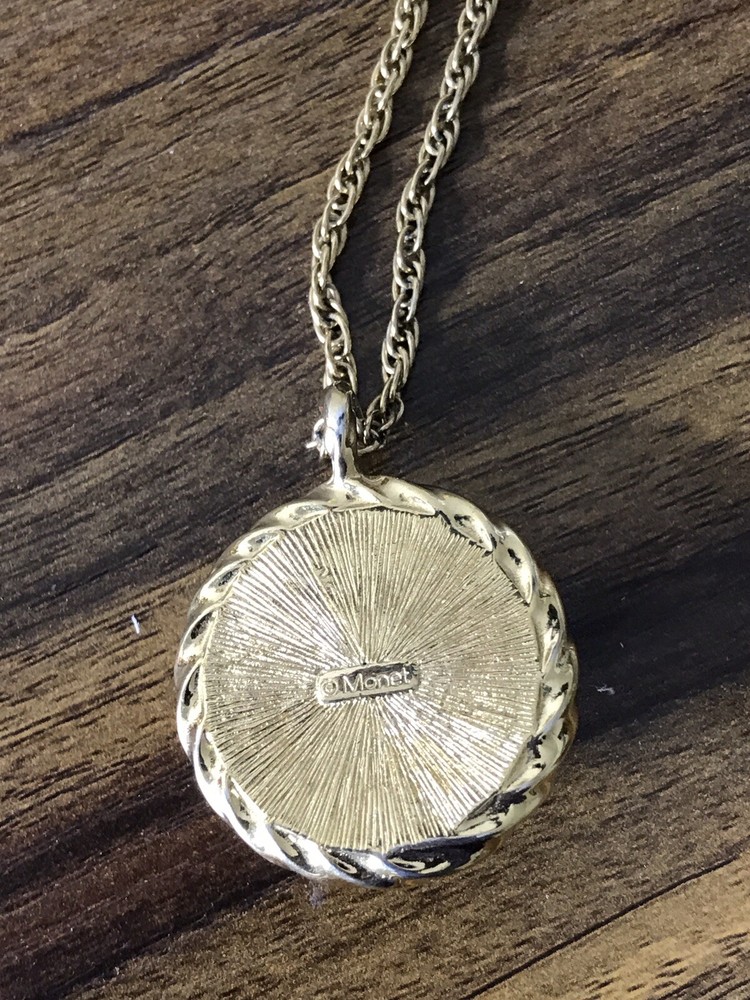 Monet Gold tone Necklace with round Pattern Pendant