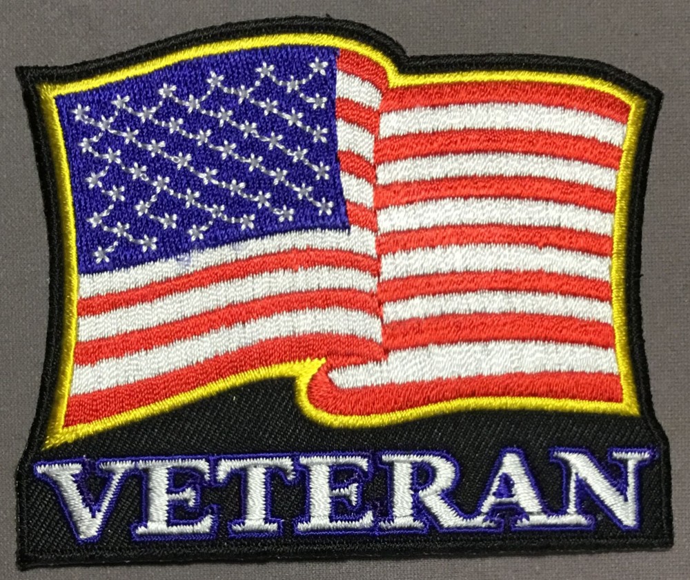 American Flag waving over our Veterans patch