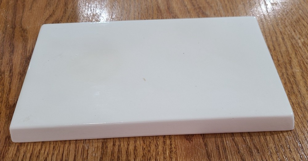 Ceramic Breadboard 8 1/2" x 4 3/4" Front is Glazed, back is unfinished Bisque