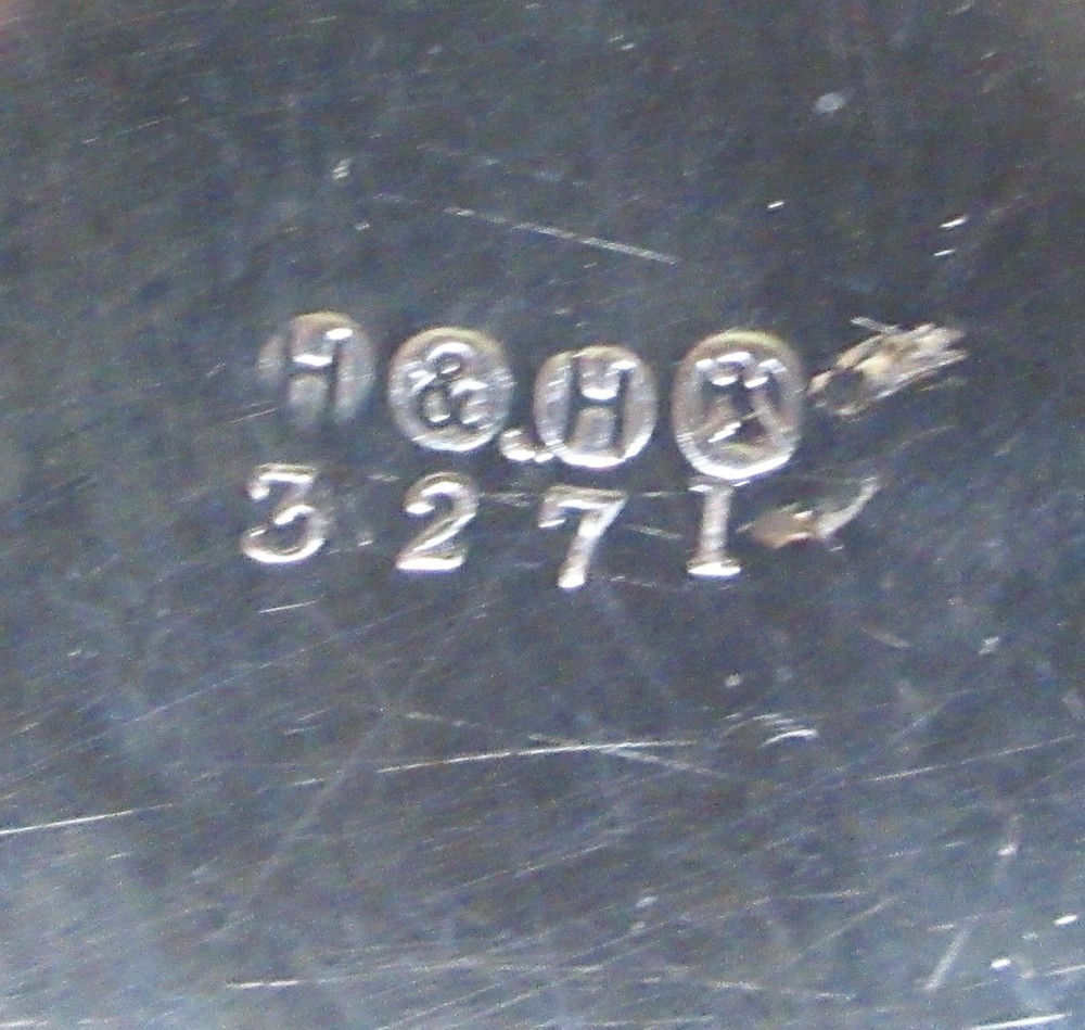 A C1890 silver-plate wine bottle holder by Hukin & Heath,