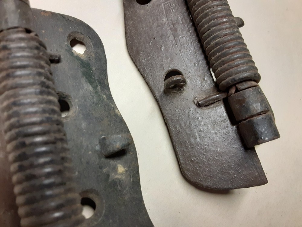 Pair of vintage spring loaded hinges