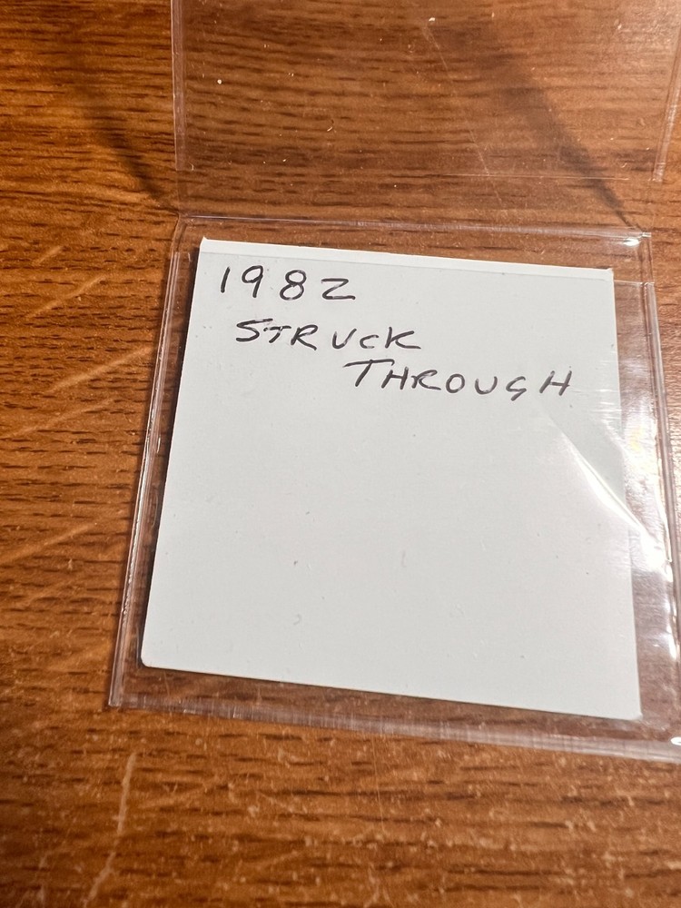 1982 ERROR JEFFERSON NICKEL STRUCK THROUGH AN OBJECT