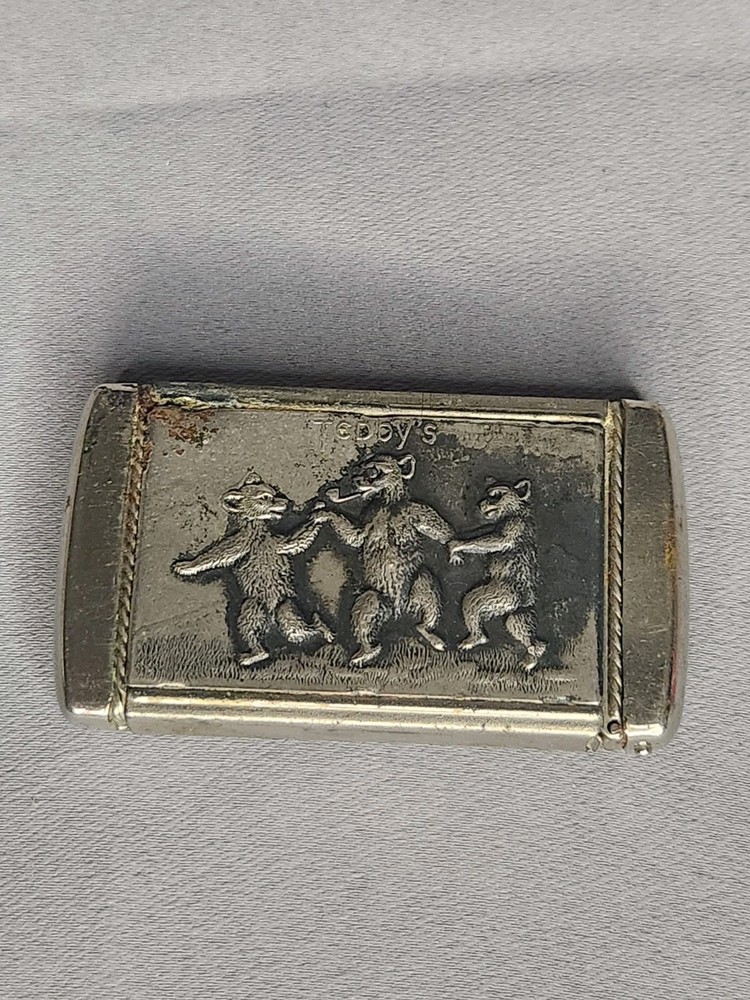 Vintage Vesta Case with Bear Pattern and Ornate Frame Design