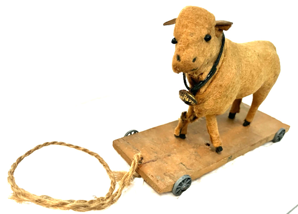 Antique childs felt covered pull toy