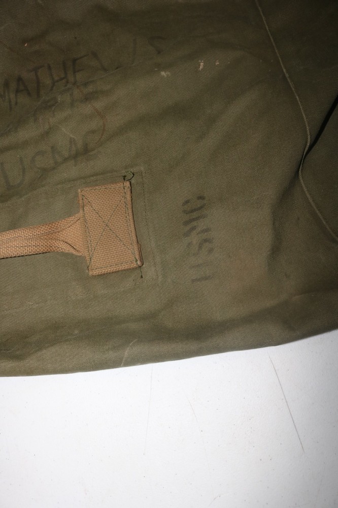 Original late WWII USMC marked transitional colored duffel bag named