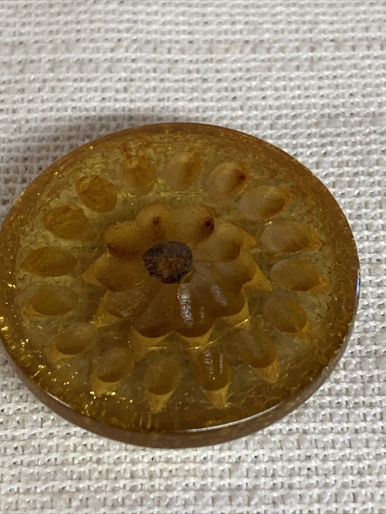 ANTIQUE CARVED FLORAL LUCITE BUTTON