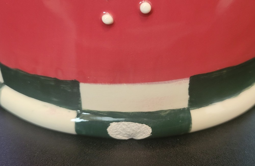 Red Ceramic Pitcher with Snowflake and Green and White checked base.
