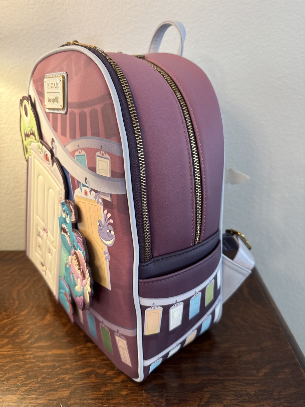 Loungefly Disney Pixar Monsters, Inc. Door Scene Mini Backpack NWT
