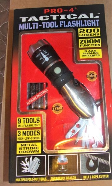 PRO-4 TACTICAL MULTI-TOOL FLASHLIGHT. NEW IN BOX.