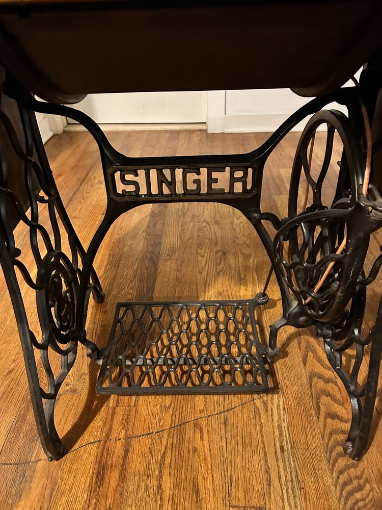 Singer Manufacturing Co. sewing machine with hideaway work station