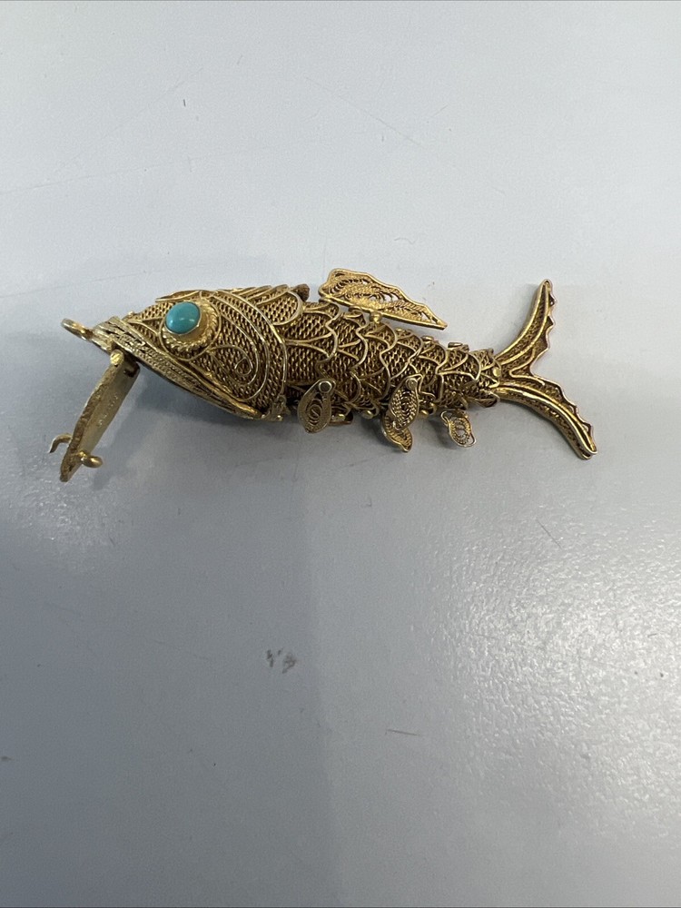 Tested as silver and gilded flexible fish, possibly pill box.