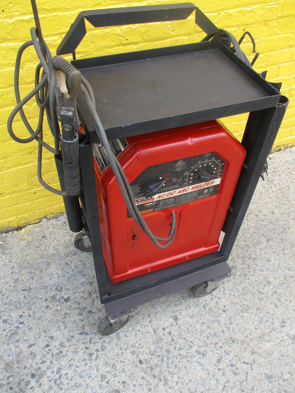 LINCOLN AC/DC 225 ARC WELDER on CART w/25ft of CABLES