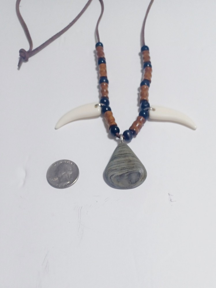 River Rock , Faux Wolf Teeth Beaded necklace .
