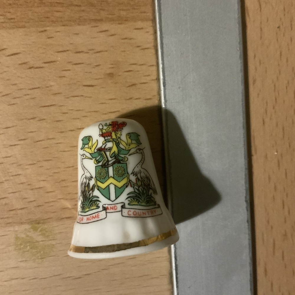 8 thimbles plus a wooden stand