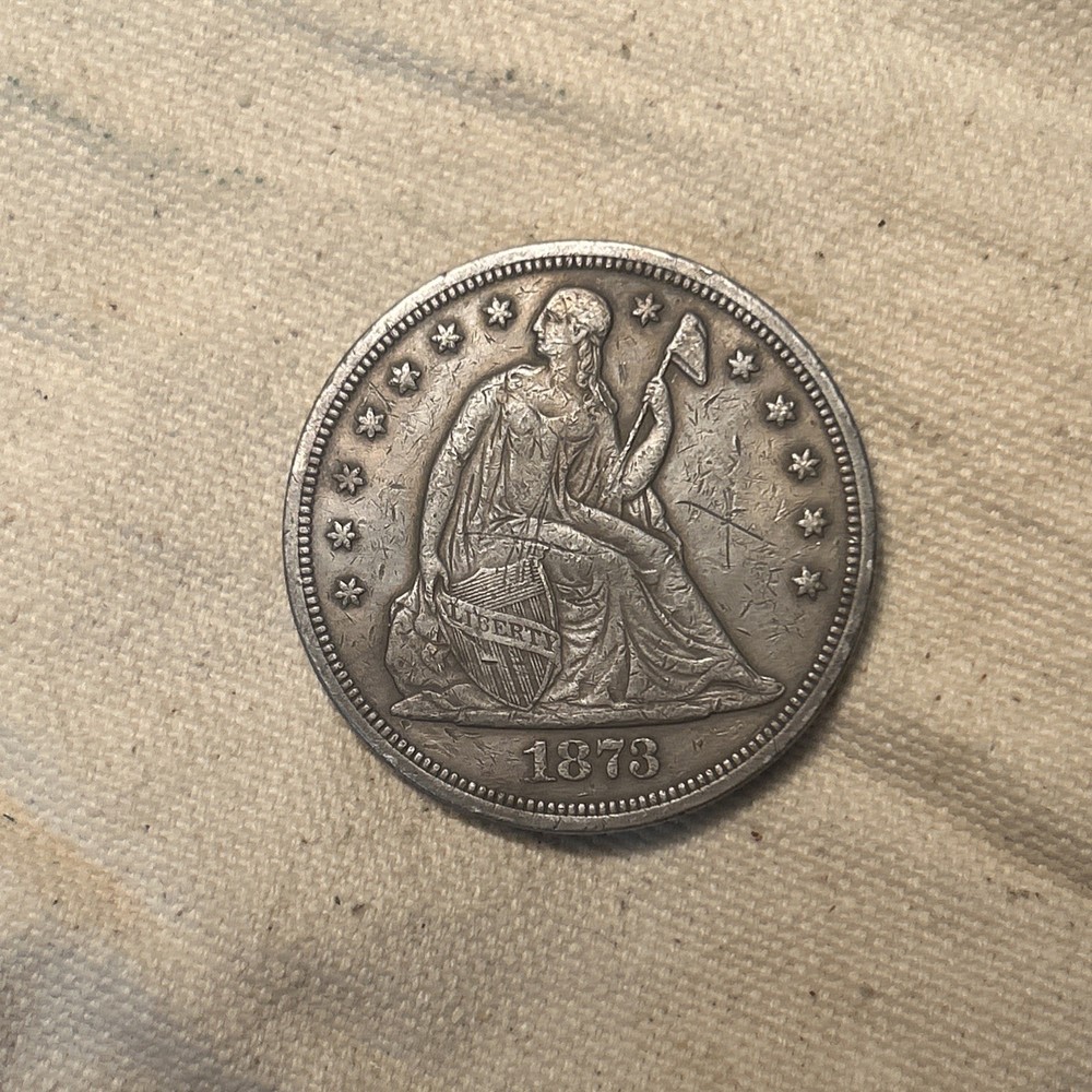 1873 US SEATED LIBERTY SILVER DOLLAR IN EXTRA FINE CONDITION