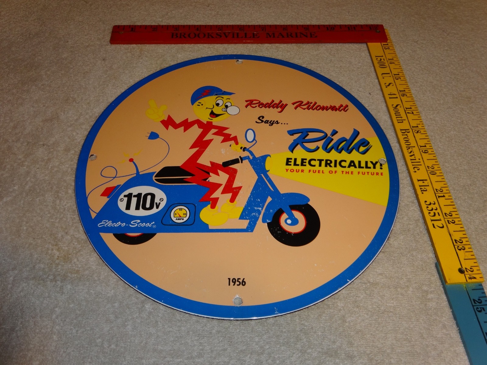 VINTAGE 56 REDDY KILOWATT ELECTRIC SCOOTER 11 3/4" PORCELAIN METAL GASOLINE SIGN