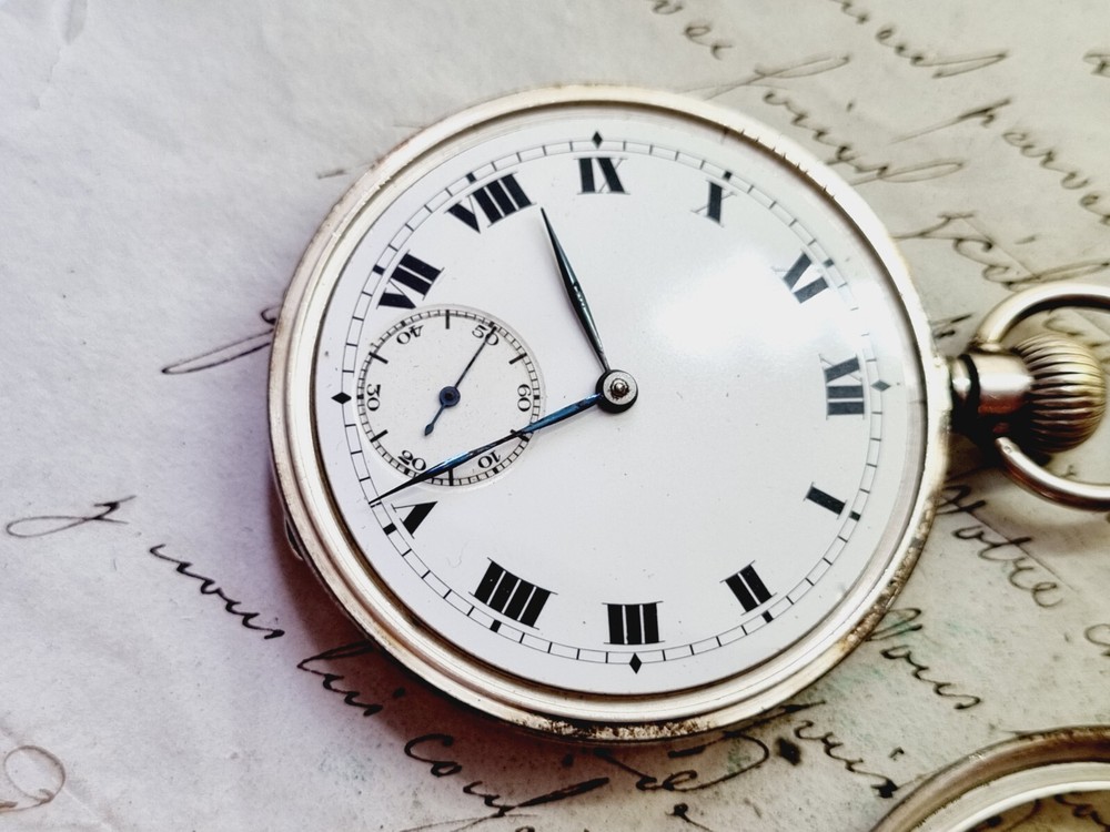 silver open face pocket watch
