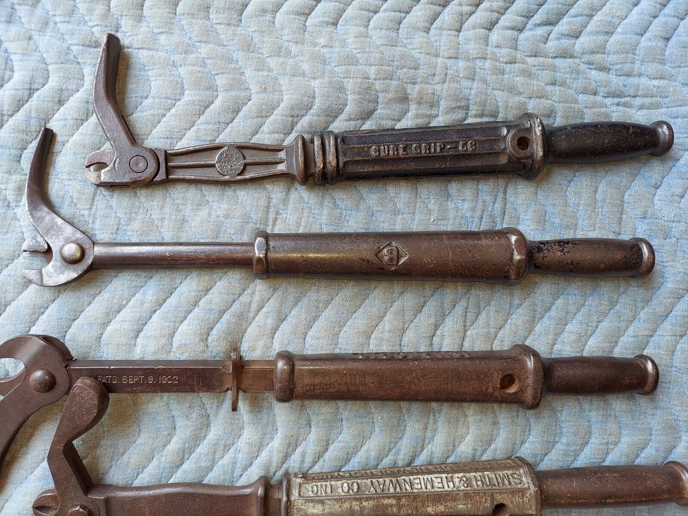 Collection of 8 different antique nail pullers